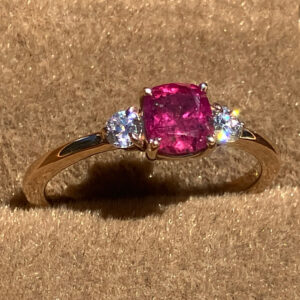 GIA Certified 1.13 carat cushion cut Winza ruby ring with two VVS1 diamond accents set in handcrafted 14k yellow gold by Silver Mountain Metals.