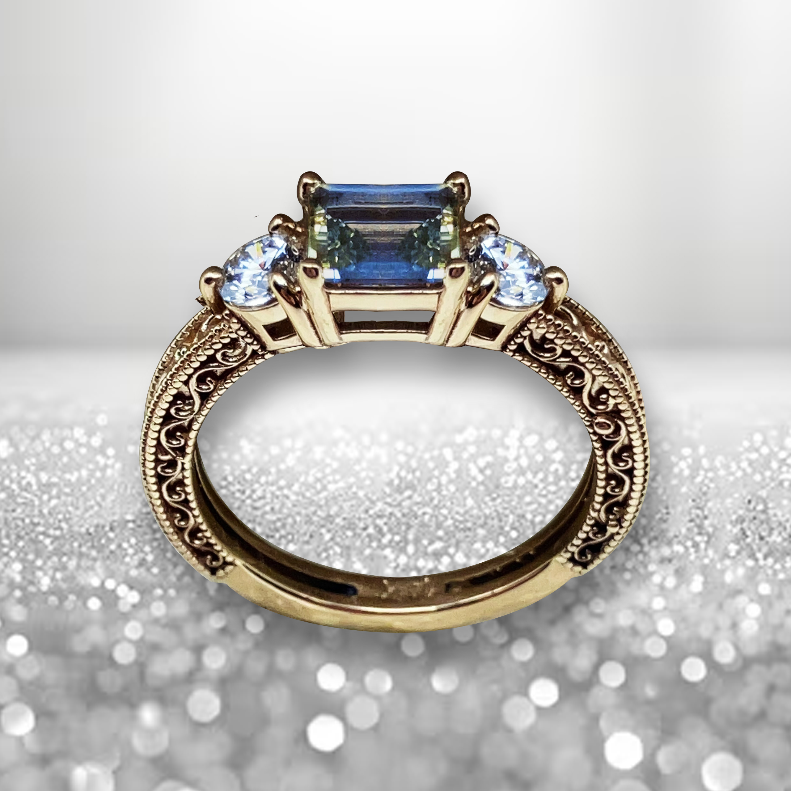 GIA Certified 1.11 carat Asscher cut color-zoned yellow-blue-yellow Ceylon sapphire ring with F Color VVS1 diamond accents in handcrafted 14k yellow gold Art Deco filigree setting by Silver Mountain Metals.