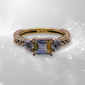 GIA Certified 1.11 carat Asscher cut color-zoned yellow-blue-yellow Ceylon sapphire ring with F Color VVS1 diamond accents in handcrafted 14k yellow gold Art Deco filigree setting by Silver Mountain Metals.